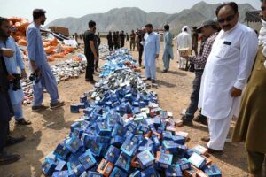 Director Customs Intelligence Karam Elahi set ablaze cigarettes, beta nuts & miscellaneous items at Shahkas district Khyber.