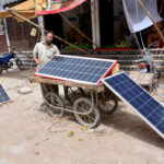 A view of solar panels installed outside shop for providing a renewable energy source at fruit market