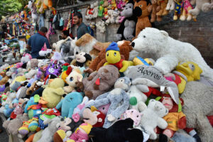 A vendor waiting for customers to sell second hand toys at his roadside setup in Provincial Capital.