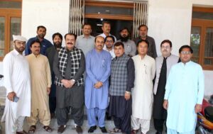 A group photograph of Chairman National Assembly Standing Committee on Information and Broadcasting Pullain Baloch with employees during his visit at Associaed Press of Pakistan (APP) Quetta Bureau.