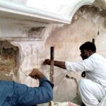 Laborers restore Nag Mandir, a Sikh-era temple, within the historic Lahore Fort, a UNESCO World Heritage Site