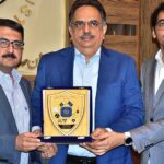 President Chamber of Commerce Abdul Ghafoor Malik presenting a shield to Saif Anwar Jappa, Director General, Punjab Housing and Town Planning Agency during Affordable Housing Program at SCCI