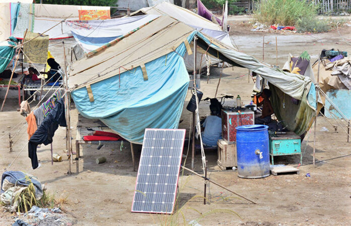 A view of solar panel installed outside a makeshift house at Qasimabad for providing a renewable energy source