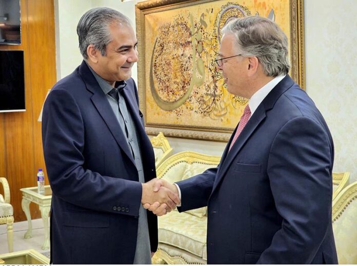Federal Minister for Interior Mohsin Naqvi presenting souvenir to US Ambassador Donald Blome