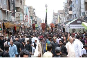 Volunteers serving food to the mourners attending the Ashura procession on 10th of Muharramul Harram. Muharram is the mourning month in remembrance of the Shahadat of Hazrat Imam Hussain (RA), the grandson of the Holy Prophet Mohammad (PBUH).