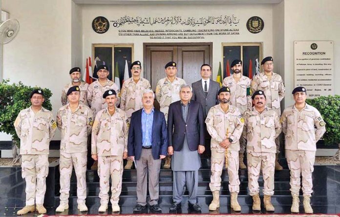 Federal Minister for Interior and Anti Narcotics Mohsin Naqvi in a group photo during his visit to ANF Headquarters