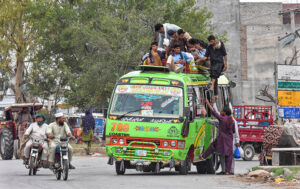 A large number of passengers travelling on rooftop of passenger bus at Rawat may cause any mishap and needs the attention of the concerned authorities