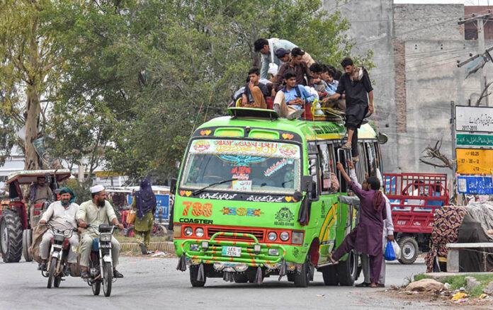 A large number of passengers travelling on rooftop of passenger bus at Rawat may cause any mishap and needs the attention of the concerned authorities