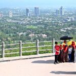 An attractive view of Faisal Masjid through famous picnic spot Daman-e-Koh
