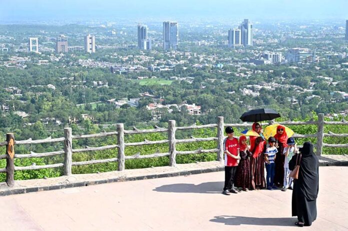 An attractive view of Faisal Masjid through famous picnic spot Daman-e-Koh