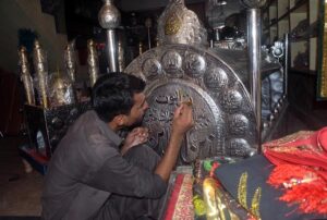A worker busy in preparing Moharam ul Haram related stuff at his workplace