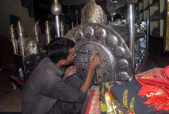 A worker busy in preparing Moharam ul Haram related stuff at his workplace