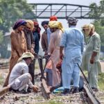 Railway workers busy in repairing work of railway tracks at Chaklala Railway Station