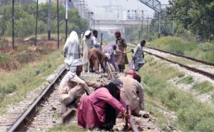 Railway workers busy in repairing work of railway tracks at Chaklala Railway Station