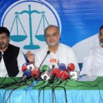 Ameer Jamaat-e-Islami Hafiz Naeem ur Rehman addressing a press conference at Islamic Center