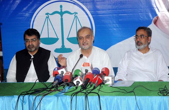 Ameer Jamaat-e-Islami Hafiz Naeem ur Rehman addressing a press conference at Islamic Center