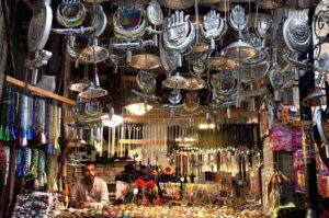 Shopkeeper displays Muharram-ul-Harram related stuff to attract the customer at Bibi Pak Daman during holy month of Muharram