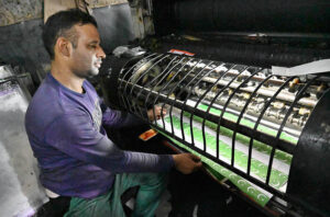 Paper flags of Pakistan are being printed at the printing press in preparation for Independence Day celebrations in Provincial Capital