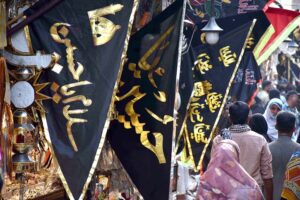 Shopkeeper displays Muharram-ul-Harram related stuff to attract the customer at Bibi Pak Daman during holy month of Muharram