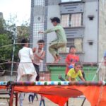 Children enjoying while jumping on a trampoline in the Provincial Capital
