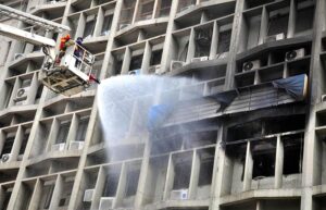Firefighters used a snorkel to extinguish a fire that erupted on the fourth floor of the Pakistan Stock Exchange building