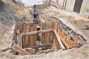 Laborers are busy in the construction work of the sewerage manhole near the excise office.