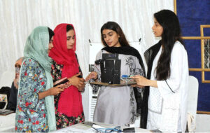 Students visiting different stalls during the Tech Expo 2024 organized by the Institute of Computer Science and Information Technology at the Jinnah Hall