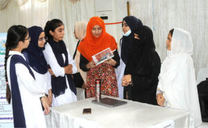 Students visiting different stalls during the Tech Expo 2024 organized by the Institute of Computer Science and Information Technology at the Jinnah Hall