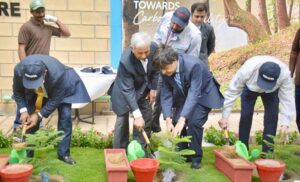 Federal Minister for Industries and Production, Mr. Rana Tanveer Hussain, is cutting the ribbon to inaugurate the vehicle export section at Toyota Indus Motors Company in Karachi