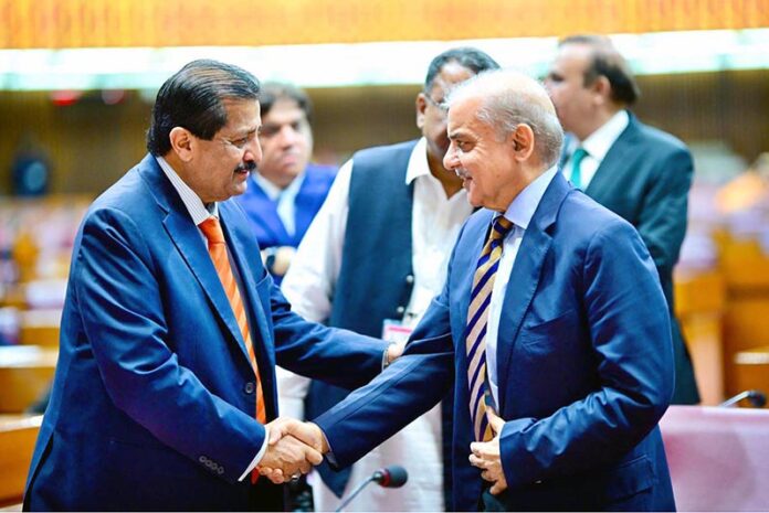 Prime Minister Muhammad Shehbaz Sharif interacts with the Parliamentarians during a session of the National Assembly