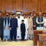 A group photograph of students and faculty members of government boys degree college Harnai, in the senate hall at Parliament House