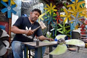 Worker repair the Air Cooler fan blades at their workplace in the Provincial Capital.