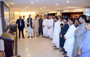 A group photograph of students and faculty members of government boys degree college Harnai, in the senate hall at Parliament House