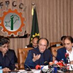 Federal Minister for Finance & Revenue, Muhammad Aurangzeb talking to media persons after meeting with Business community at FPCCI