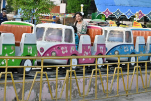 A girl enjoying a toy vehicle at Finland Rani Bagh.