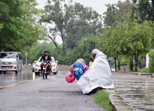 Vehicles on the way at Islamabad Highway during rain that experienced the Federal Capital.