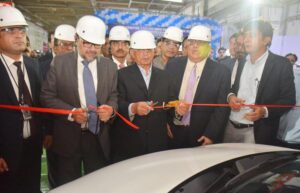 Federal Minister for Industries and Production Mr. Rana Tanveer Hussain is cutting ribbon at Pak Suzuki Motors