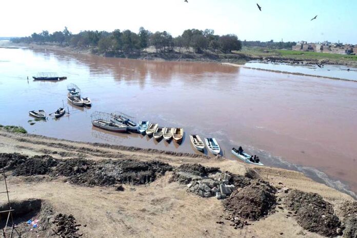 A view of boats parked at the bank of River Ravi in the provincial capital