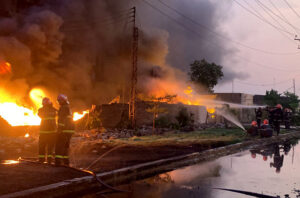 Rescue 1122 officials busy in extinguishing fire at pesticide factory in industrial estate.