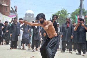 Mourners oozing themselves with knives and chains during the main procession of 10th Muharram-ul-Haram. Muharram is the mourning month in remembrance of the Shahadat of Hazrat Imam Hussain (RA), the Grandson of the Holy Prophet Mohammad (PBUH).