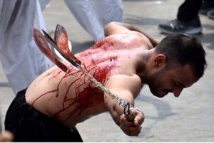 Mourners oozing themselves with knives and chains during the procession of 9th Muharram-ul-Haram. Muharramul Harram known as the first month of the Islamic calendar and the mourning month in remembrance of the martyrdom (Shahadat) of Hazrat Imam Hussain (RA), the grandson of the Holy Prophet Mohammad (PBHU).