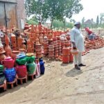 A vendor display and sells pottery at his roadside setup