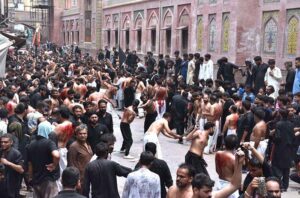 Mourners oozing themselves with knives and chains during procession of 10th of Muharram-ul-Haram. Muharram is the mourning month in remembrance of the Shahadat of Hazrat Imam Hussain (RA), the Grandson of the Holy Prophet Mohammad (PBUH).