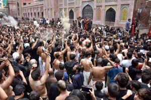 Mourners oozing themselves with knives and chains during procession of 10th of Muharram-ul-Haram. Muharram is the mourning month in remembrance of the Shahadat of Hazrat Imam Hussain (RA), the Grandson of the Holy Prophet Mohammad (PBUH).
