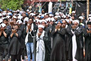 Mourners offering Zuhar prayers at M.A. Jinnah Road during the procession of 9th Muharram-ul-Haram. Muharramul Harram known as the first month of the Islamic calendar and the mourning month in remembrance of the martyrdom (Shahadat) of Hazrat Imam Hussain (RA), the grandson of the Holy Prophet Mohammad (PBUH).