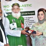 Chairperson of Women's Chamber of Commerce, Dr. Maryam Nauman, presenting a bag To Chacha Cricket (Haji Abdul Jalil) during a seminar ‘’No to Plastic campaign” on the initiative of Chief Minister Punjab organized by WCCIS