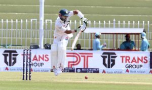 Pakistani batsman Mohammad Rizwan celebrates after scoring century (100 runs) during the 2nd day of the 1st Test cricket match between Pakistan and Bangladesh teams at the Rawalpindi Cricket Stadium