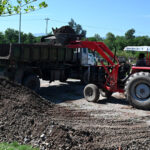 CDA workers clearing ground for planting trees on the greenbelt along Muree road