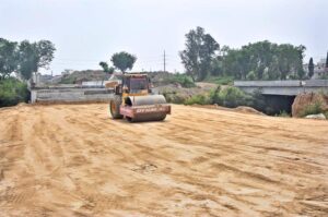 Heavy machinery is being used for the construction of bridge at the site of under construction 10th Avenue during development work in Federal Capital.