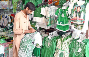 A garment vendor selling, a beautiful outfits for tiny Patriots with big style on upcoming celebrating Independence Day, 14th August, at Aabpara Market in Federal Capital.